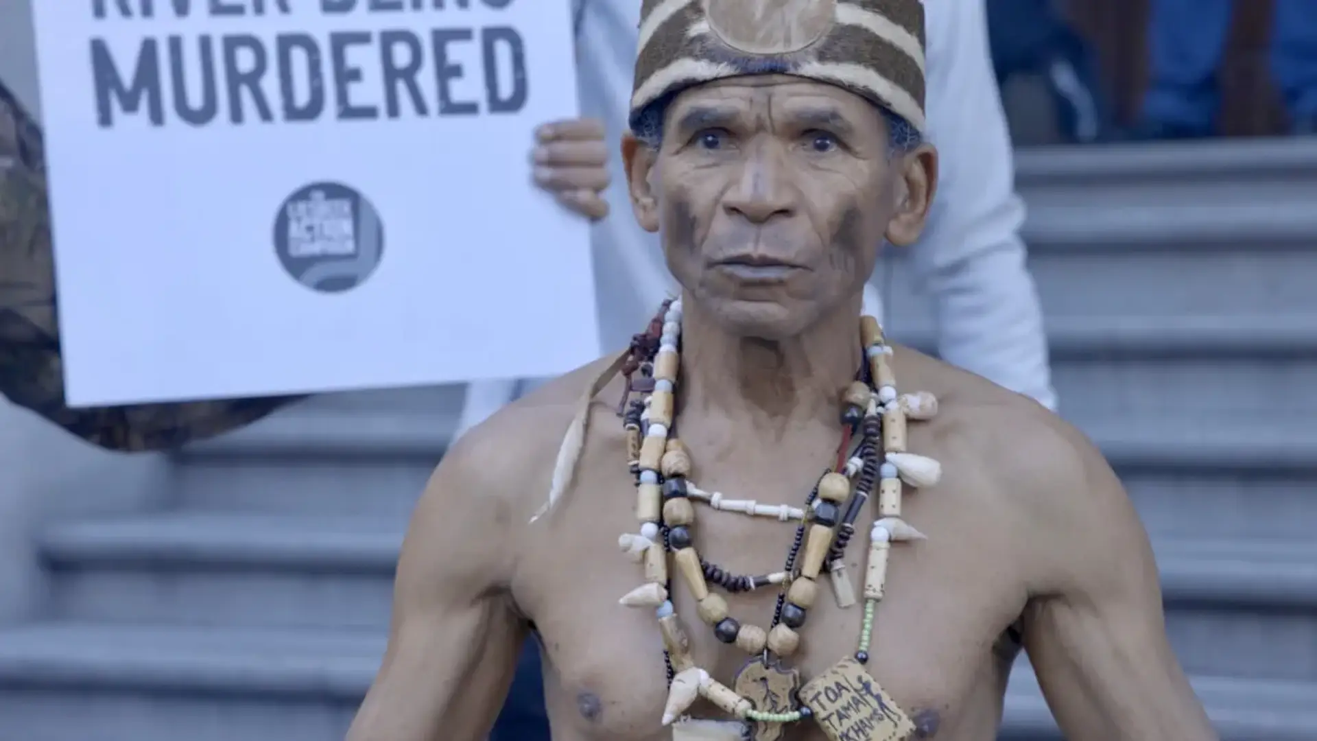 A protesting man wearing a traditional attire